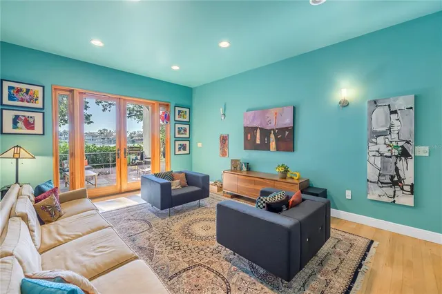 a living room with furniture and a book shelf