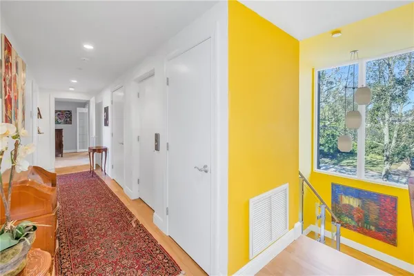 a room with furniture a rug and a window