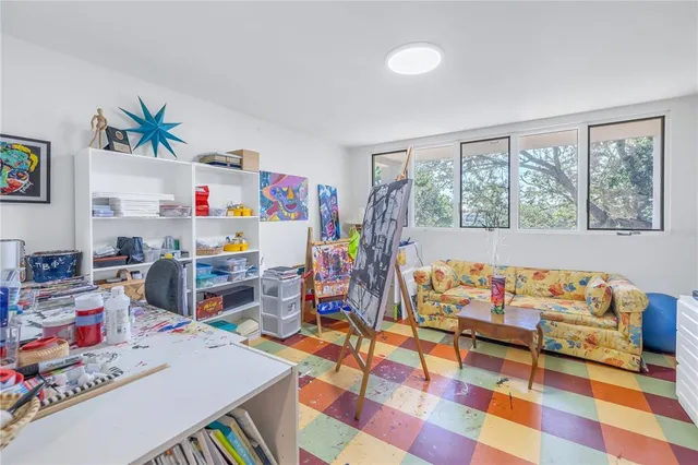 a bedroom with a sink and a dresser
