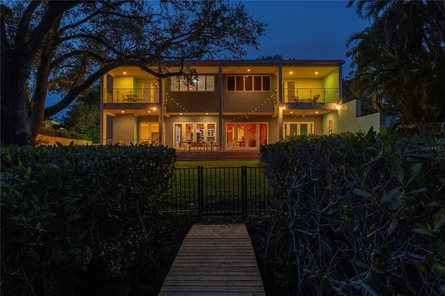 a view of a brick house with a yard