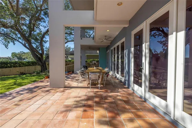 a view of a backyard with large trees