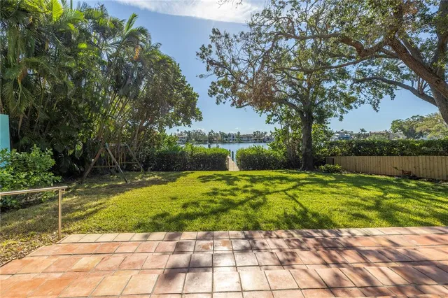 a front view of a building with a garden