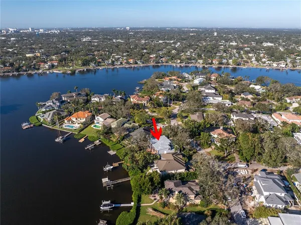 an aerial view of a houses with yard