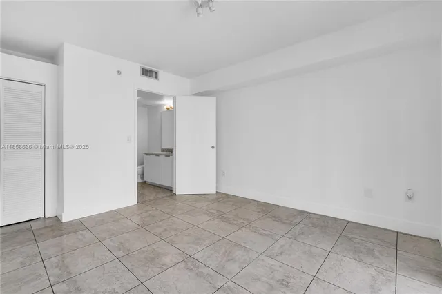 a backyard of a house with fountain table and chairs