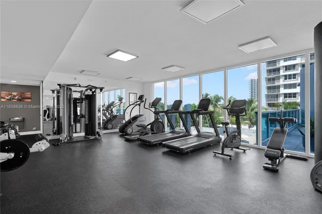 an view of kitchen with stainless steel appliances granite countertop a living room