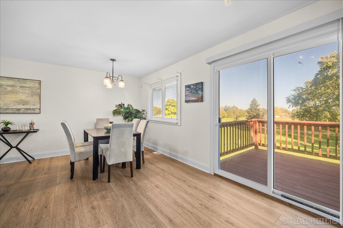 5628 Crestwood Road Matteson, IL 60443 - Photo 11 of 29 a view of a dining room with furniture window and wooden floor