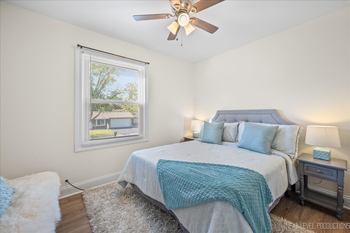 5628 Crestwood Road Matteson, IL 60443 - Photo 14 of 29 a bedroom with a bed and a window