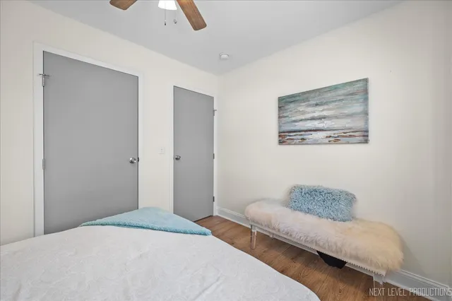 a bedroom with a bed and a couch