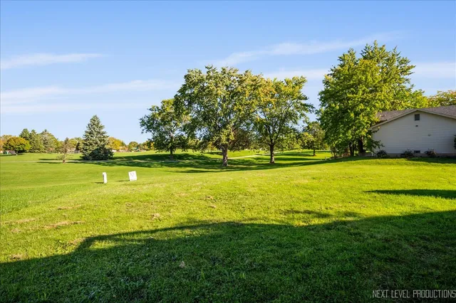 a view of a swimming pool with an outdoor space and seating area