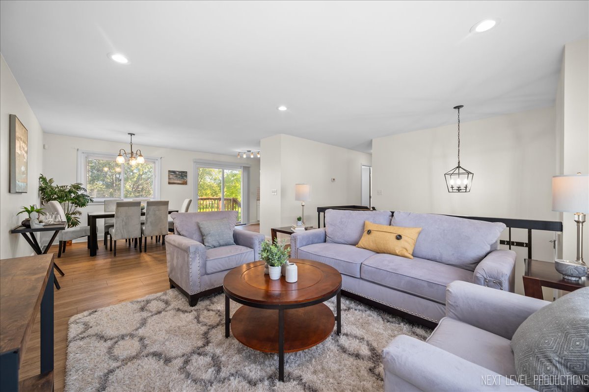 5628 Crestwood Road Matteson, IL 60443 - Photo 5 of 29 a living room with furniture and a chandelier