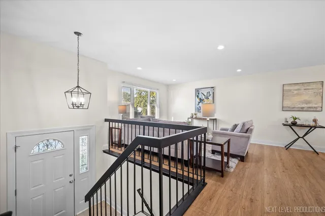 a view of a room with furniture wooden floor and window