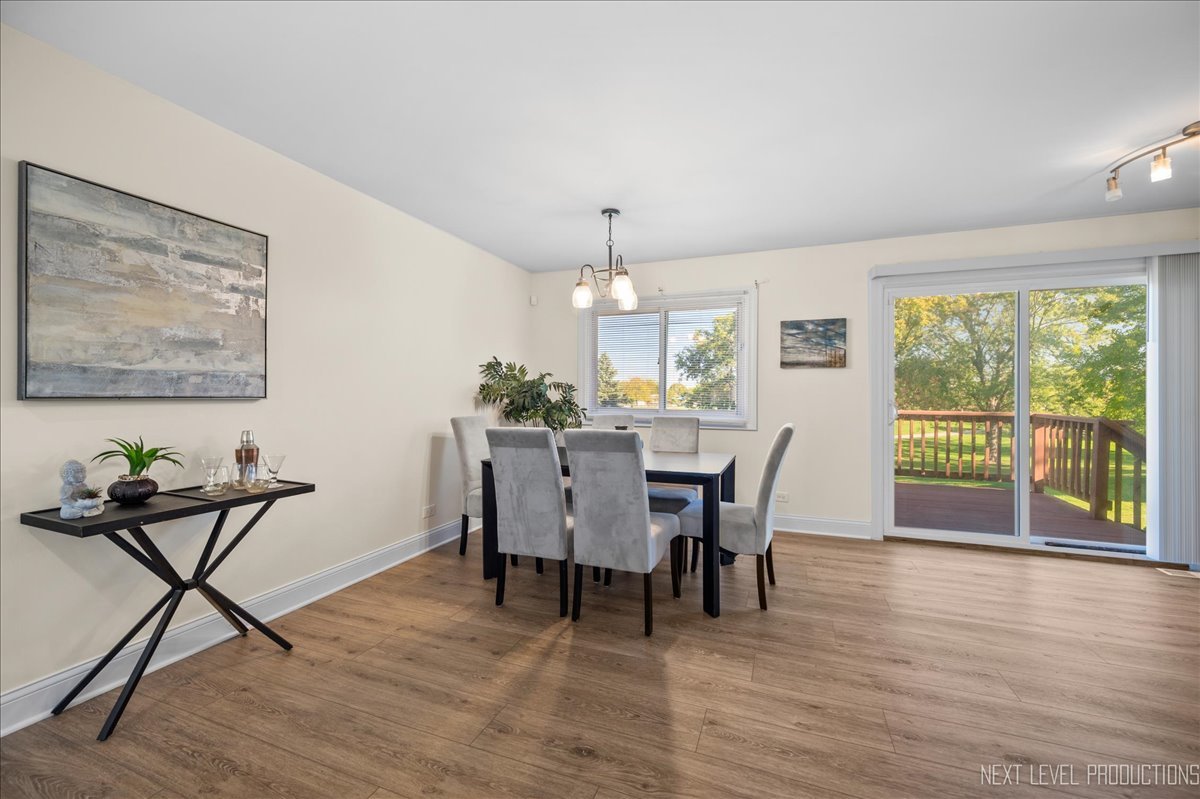 5628 Crestwood Road Matteson, IL 60443 - Photo 9 of 29 a view of a dining room with furniture window and wooden floor
