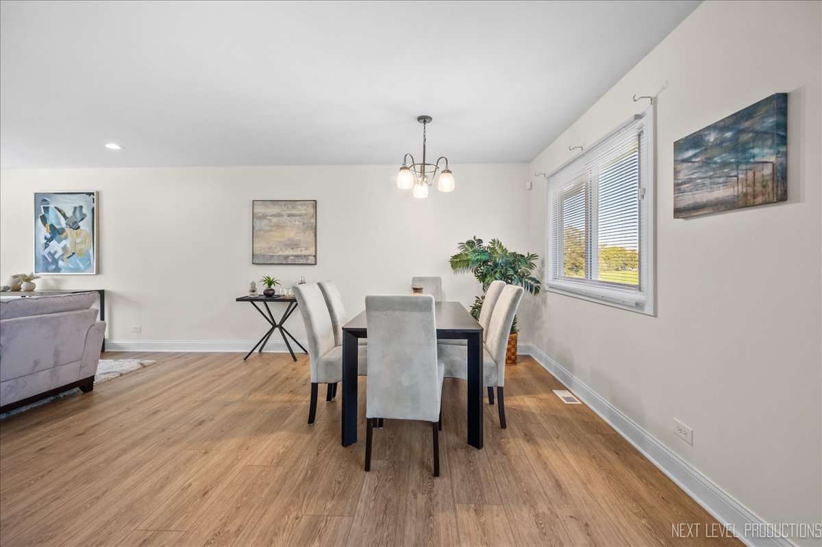 5628 Crestwood Road Matteson, IL 60443 - Photo 10 of 29 a view of a dining room with furniture and wooden floor
