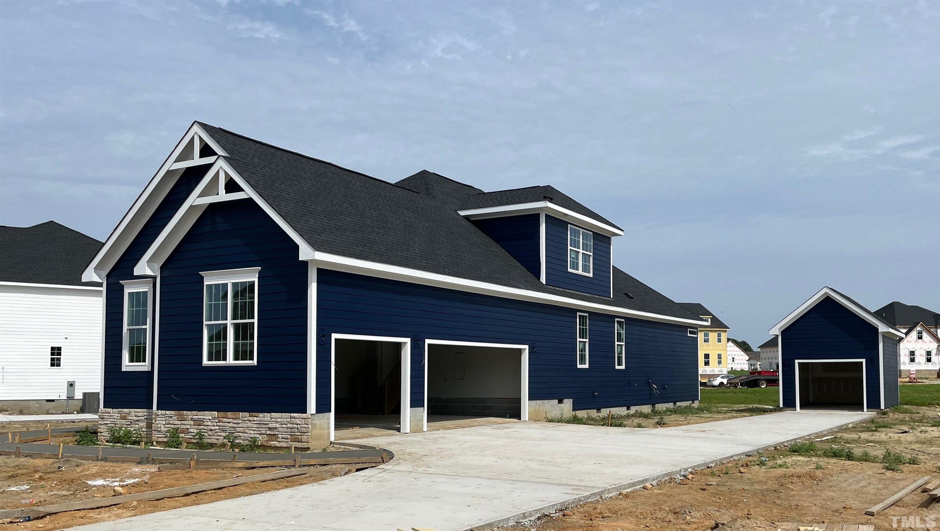 201 Dungannon Loop Clayton, NC 27520 - Photo 2 of 35 a front view of a house with yard