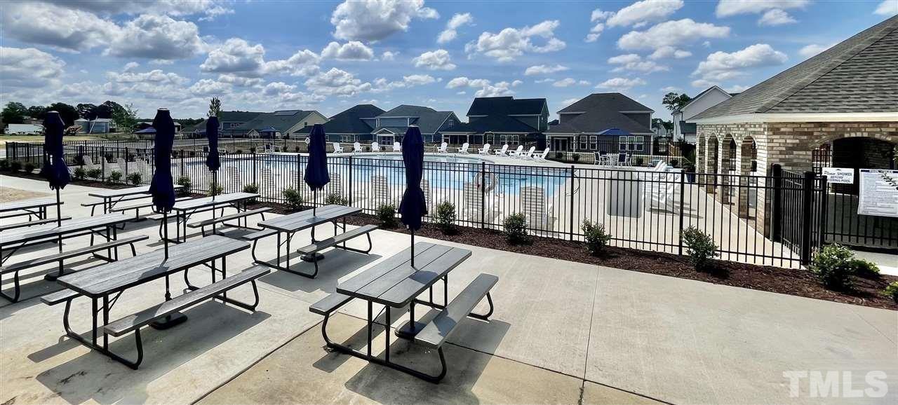 201 Dungannon Loop Clayton, NC 27520 - Photo 33 of 35 a view of a patio with swimming pool and sitting area