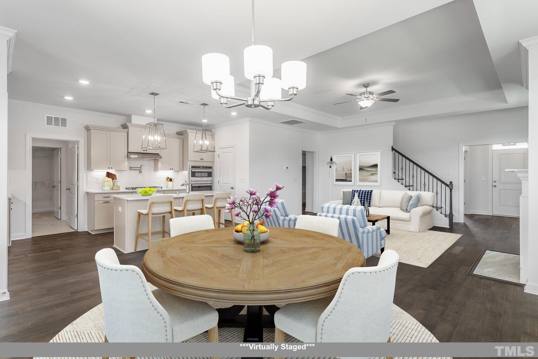 201 Dungannon Loop Clayton, NC 27520 - Photo 5 of 35 a view of a dining room with furniture and wooden floor