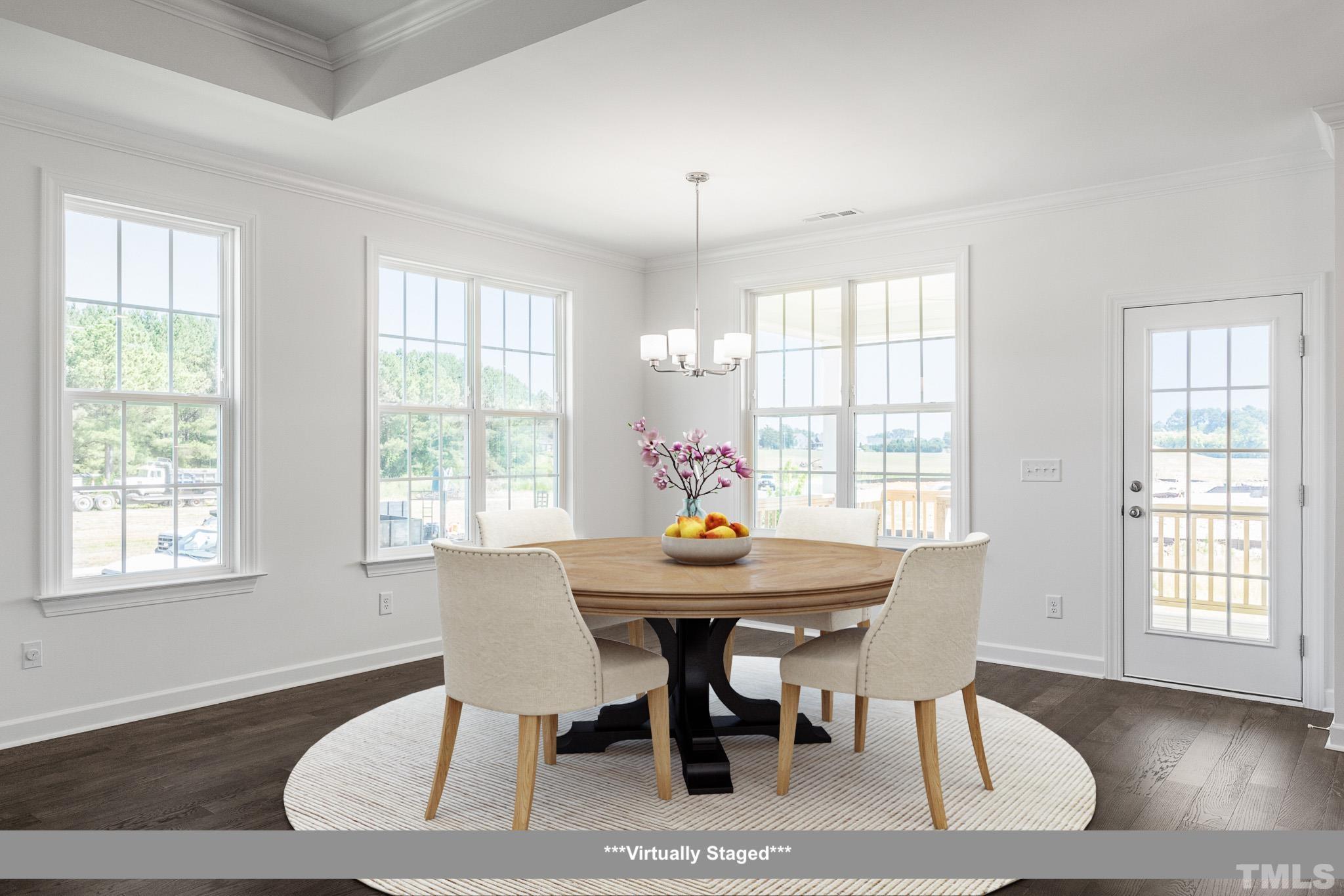 201 Dungannon Loop Clayton, NC 27520 - Photo 6 of 35 a view of a dining room with furniture and wooden floor