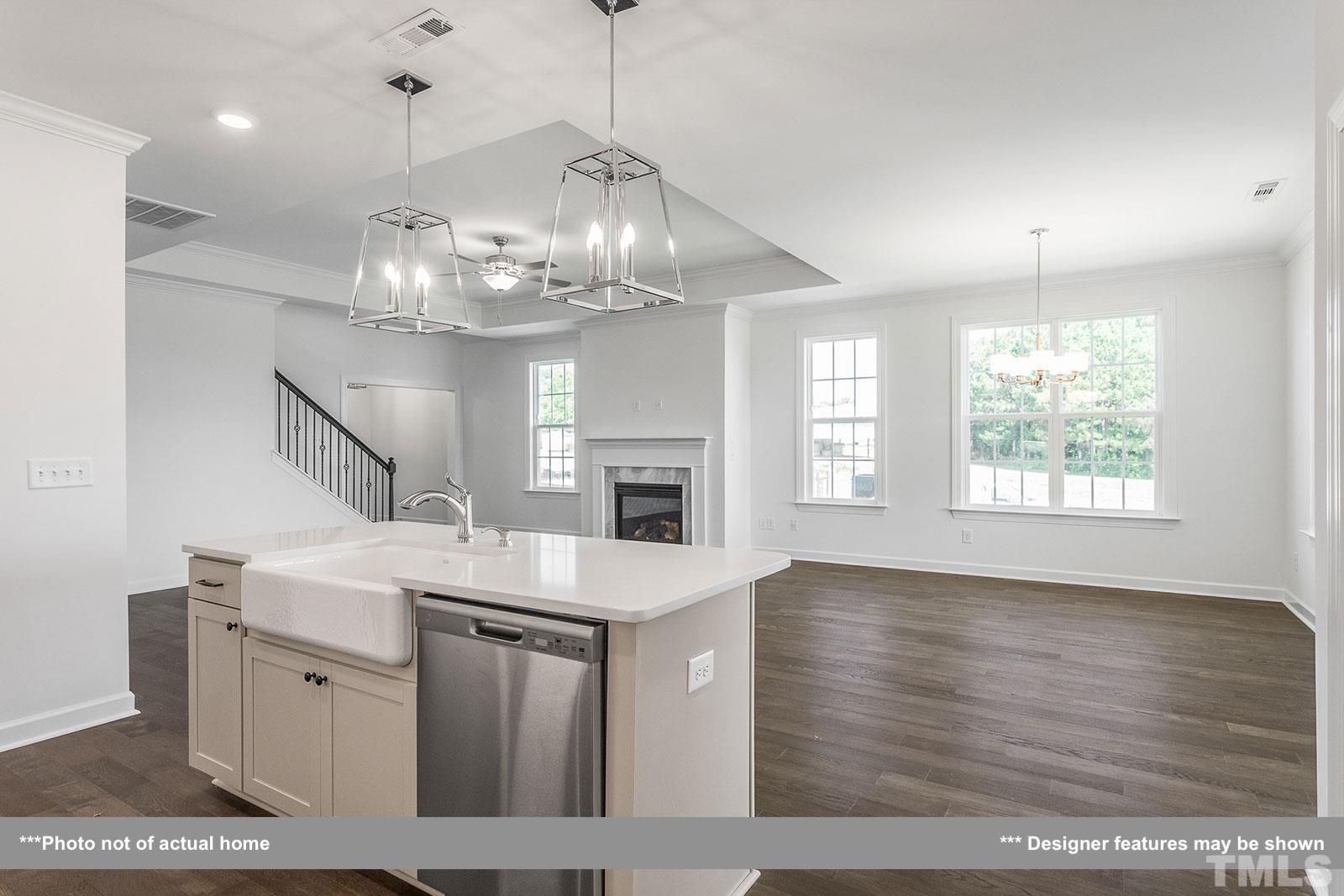 201 Dungannon Loop Clayton, NC 27520 - Photo 9 of 35 a view of a kitchen sink and chandelier