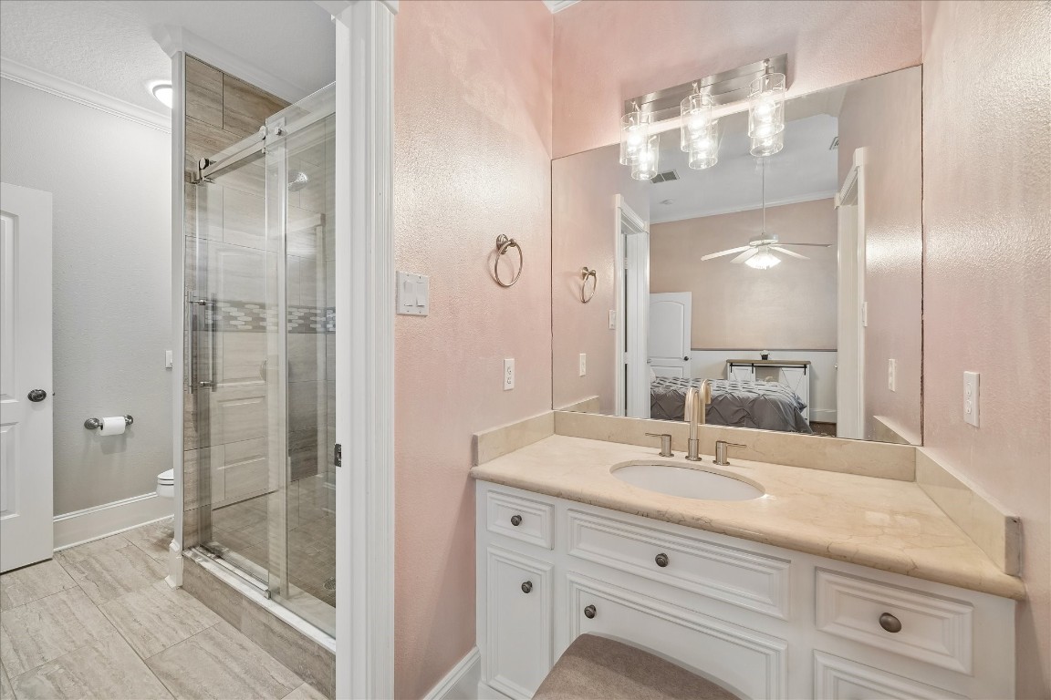 3711 Drake Street Houston, TX 77005 - Photo 20 of 34 Private vanity for 2nd bedroom and view of the Jack and Jill bath shared by 2nd and 3rd bedroom.