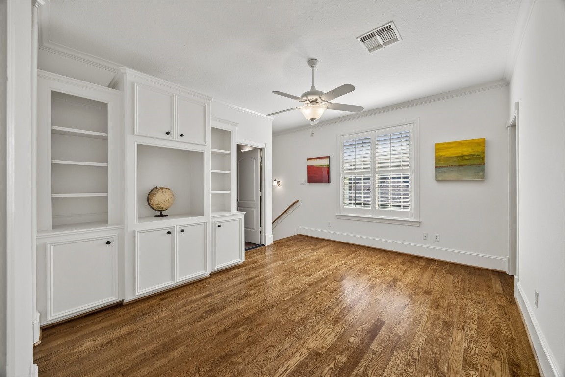 3711 Drake Street Houston, TX 77005 - Photo 26 of 34 Game room area perfect for game table, study room or upstairs playroom with built-ins and access to back staircase.