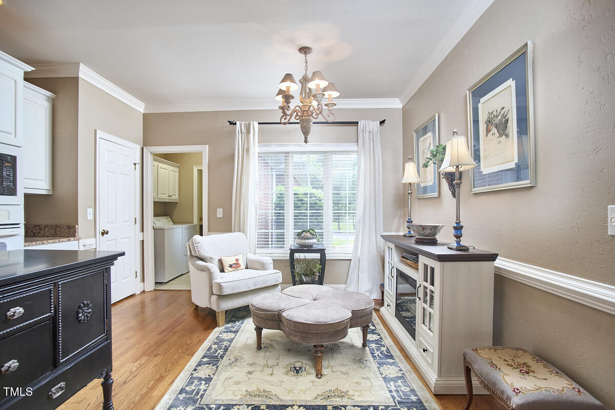 1344 Longleaf Drive Fayetteville, NC 28305 - Photo 12 of 46 a living room with furniture and a chandelier