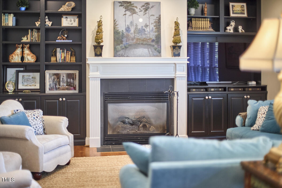 1344 Longleaf Drive Fayetteville, NC 28305 - Photo 23 of 46 a living room with furniture and a fireplace
