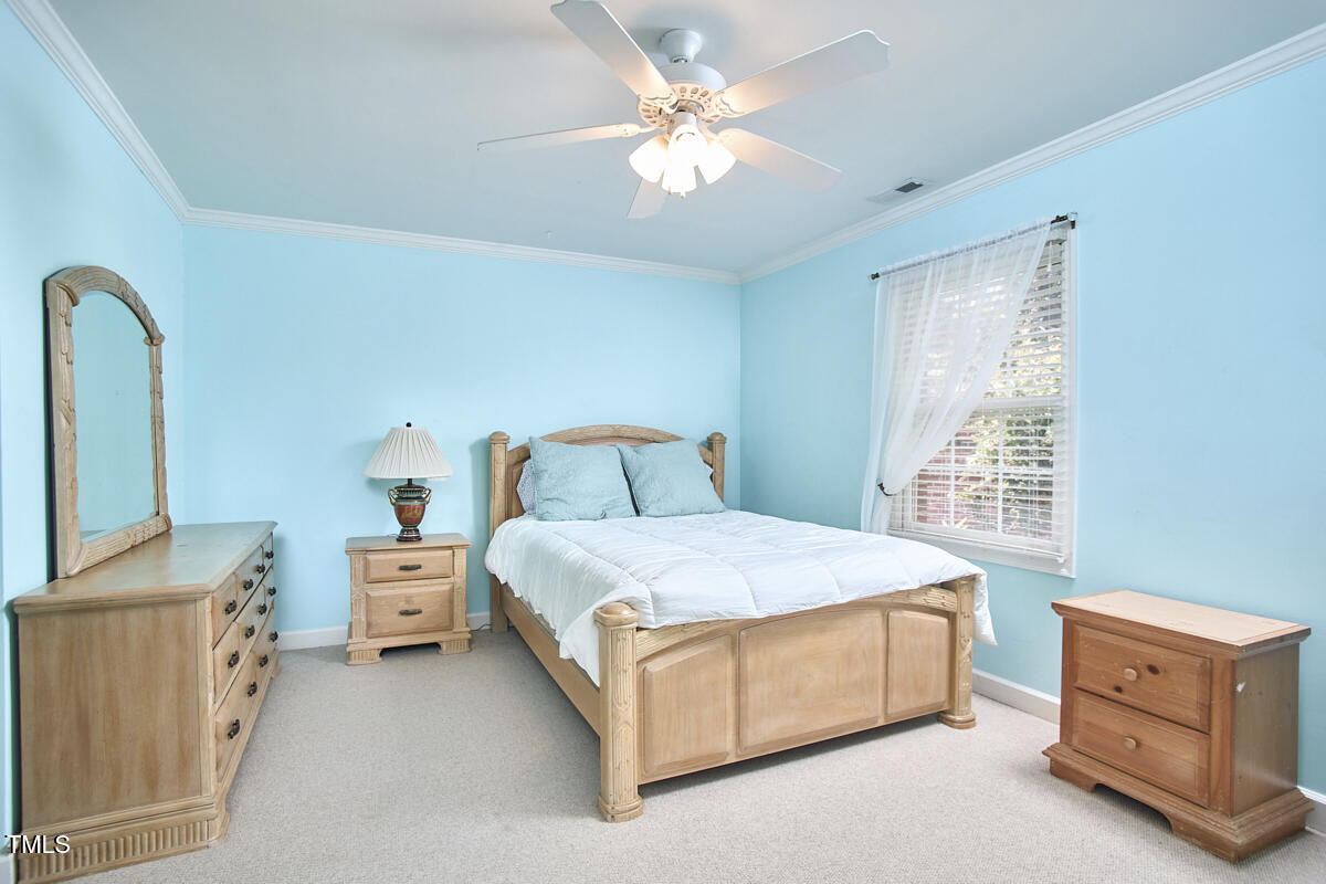 1344 Longleaf Drive Fayetteville, NC 28305 - Photo 36 of 46 a spacious bedroom with a bed and a dresser