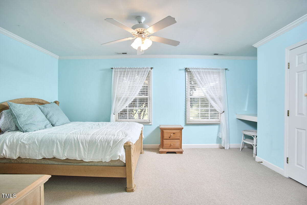 1344 Longleaf Drive Fayetteville, NC 28305 - Photo 37 of 46 a bedroom with a bed and a table in it