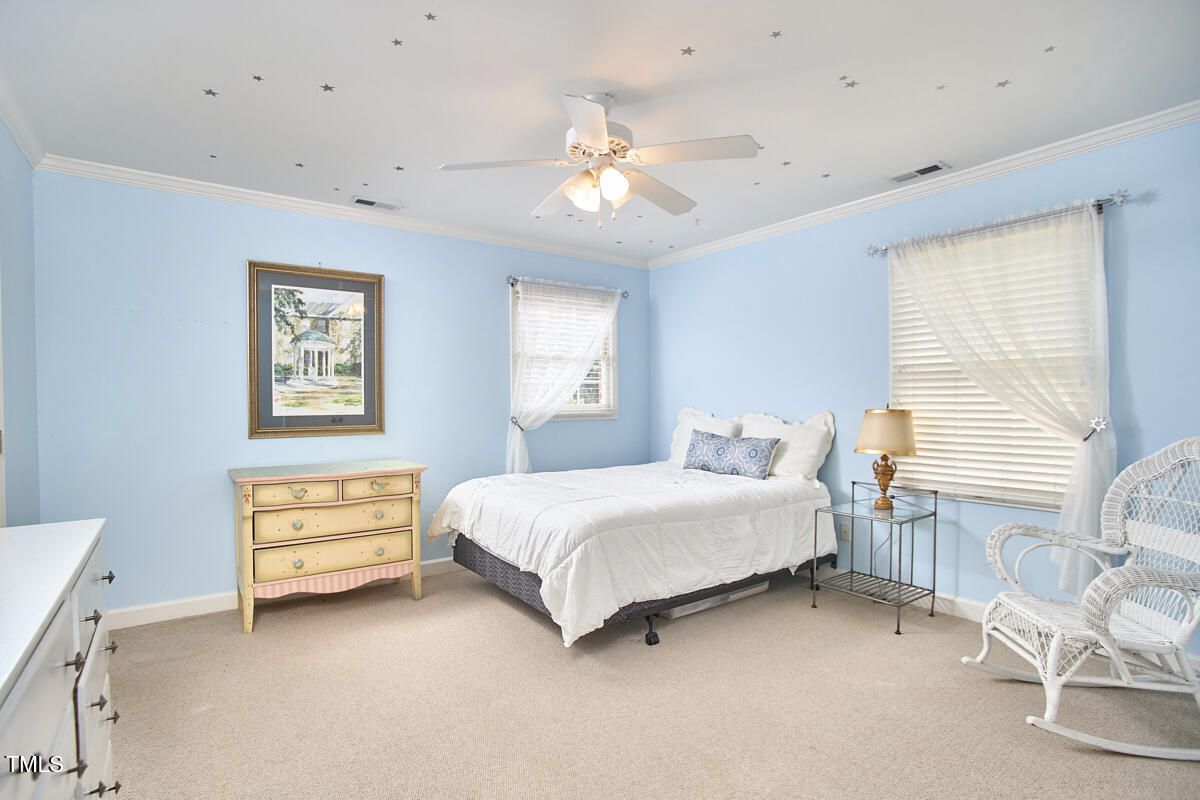 1344 Longleaf Drive Fayetteville, NC 28305 - Photo 38 of 46 a spacious bedroom with a bed and a window