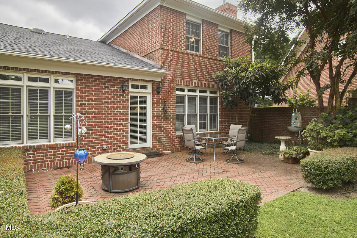 1344 Longleaf Drive Fayetteville, NC 28305 - Photo 44 of 46 a view of a patio with table and chairs and potted plants