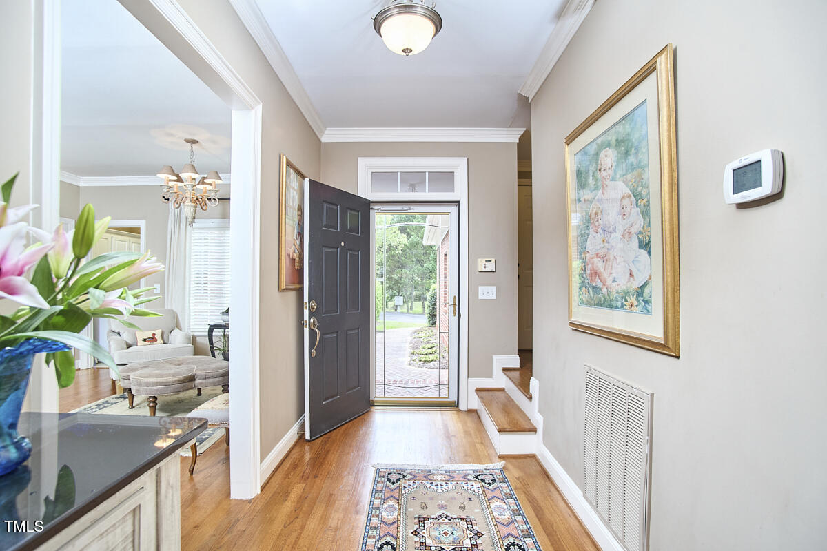 1344 Longleaf Drive Fayetteville, NC 28305 - Photo 5 of 46 a view of a hallway view with wooden floor and furniture