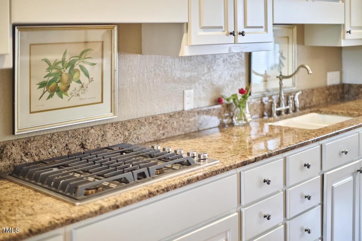 1344 Longleaf Drive Fayetteville, NC 28305 - Photo 9 of 46 a kitchen with stainless steel appliances granite countertop a sink stove and cabinets