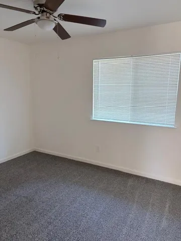 a view of a room that has a window in it