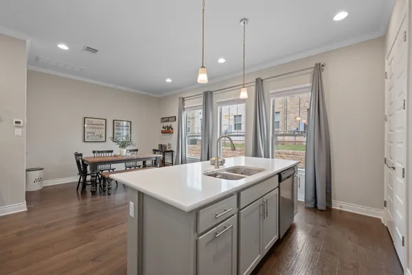 a kitchen with a stove and a sink