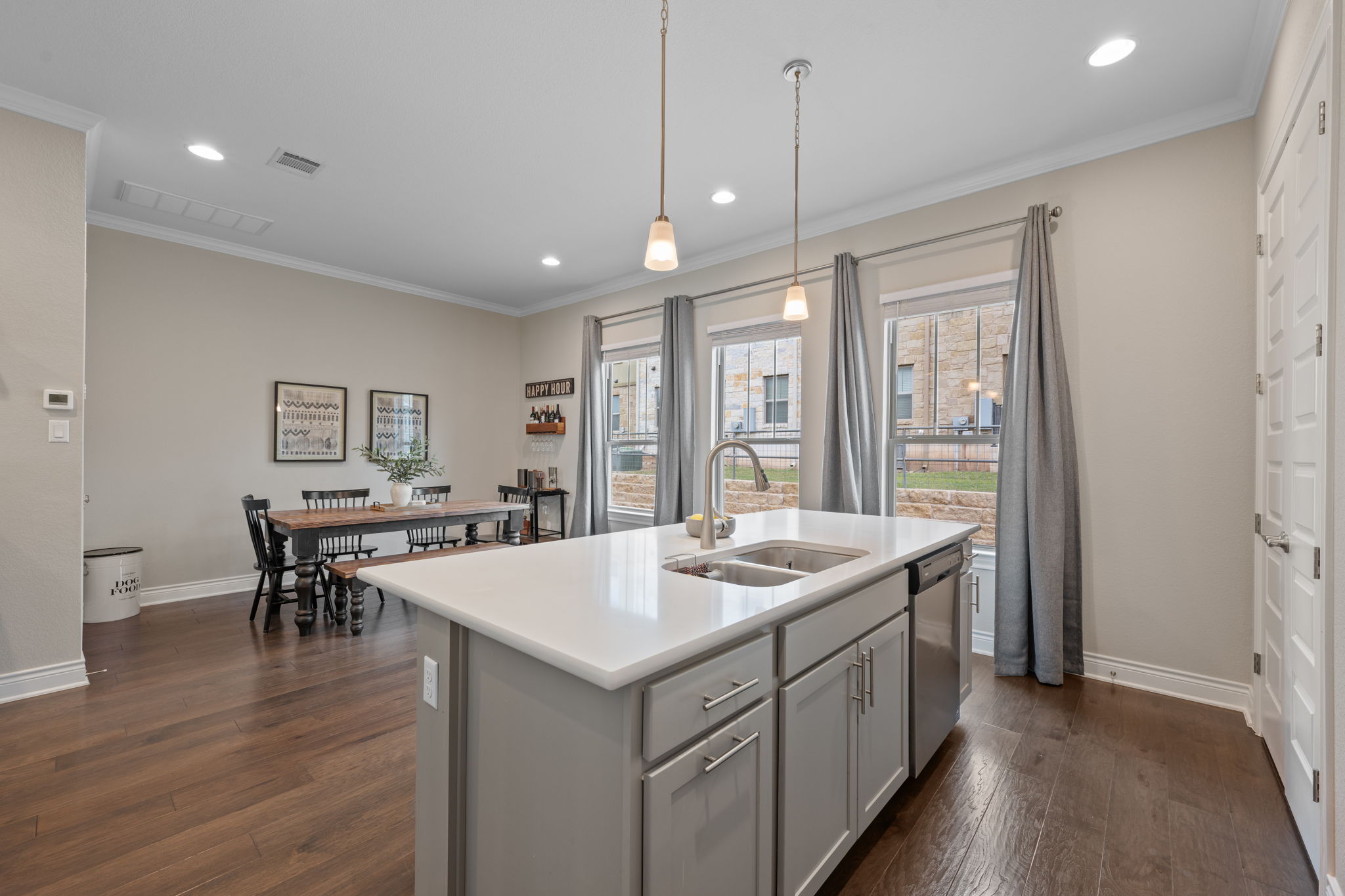 308 Adams Street Georgetown, TX 78628 - Photo 13 of 39 a kitchen with a stove and wooden floor