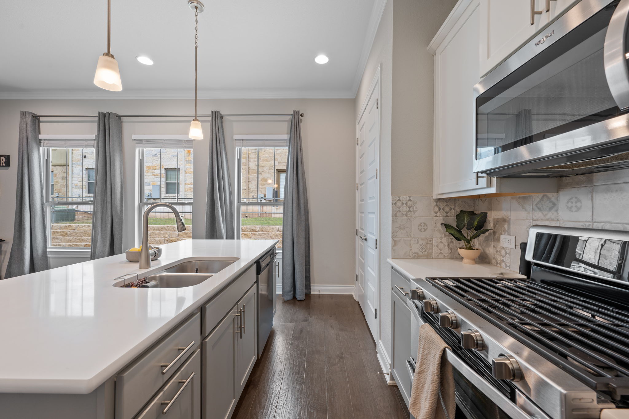 308 Adams Street Georgetown, TX 78628 - Photo 14 of 39 a kitchen with a stove and a sink