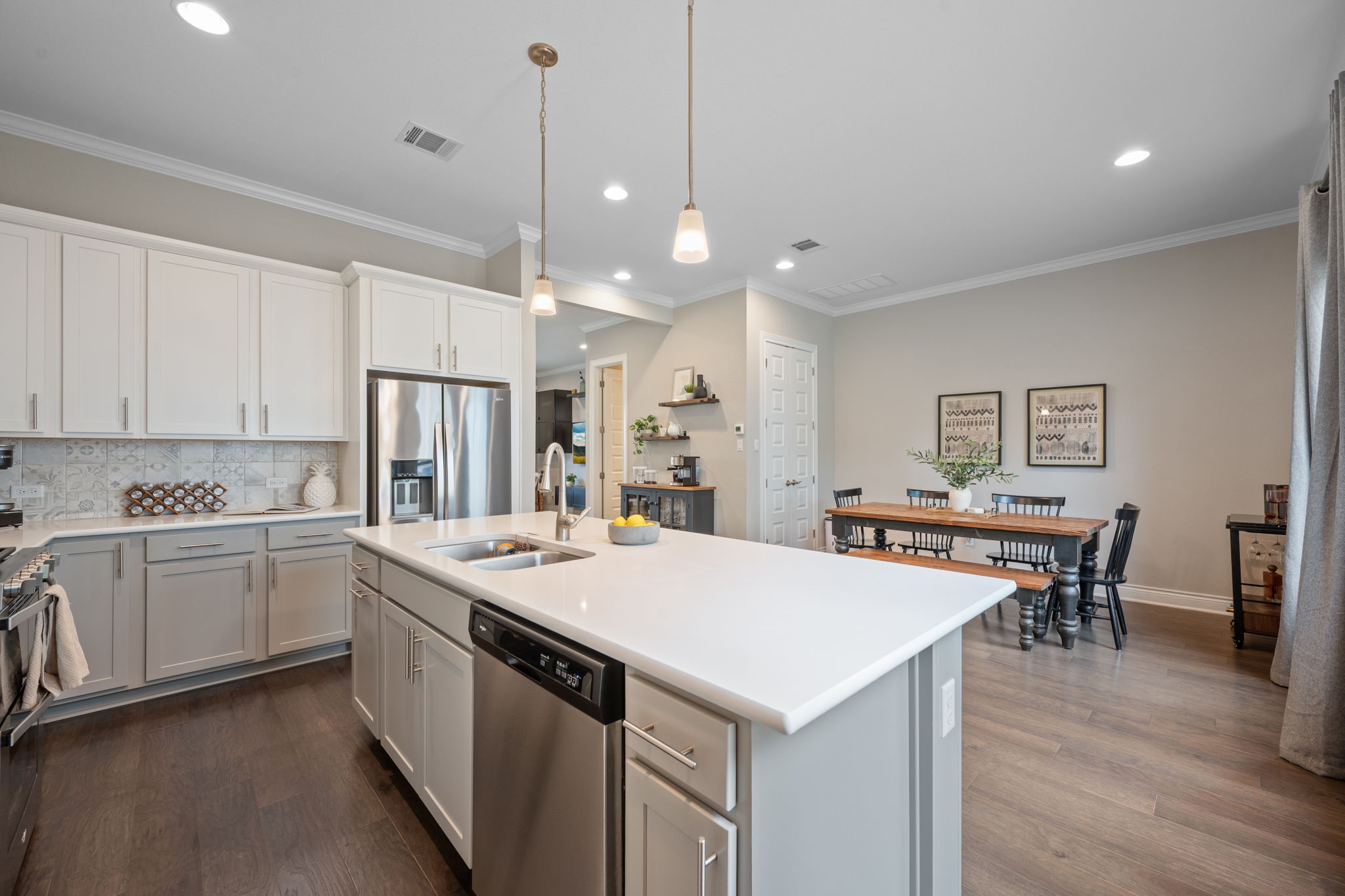 308 Adams Street Georgetown, TX 78628 - Photo 16 of 39 a large kitchen with kitchen island a sink table and chairs