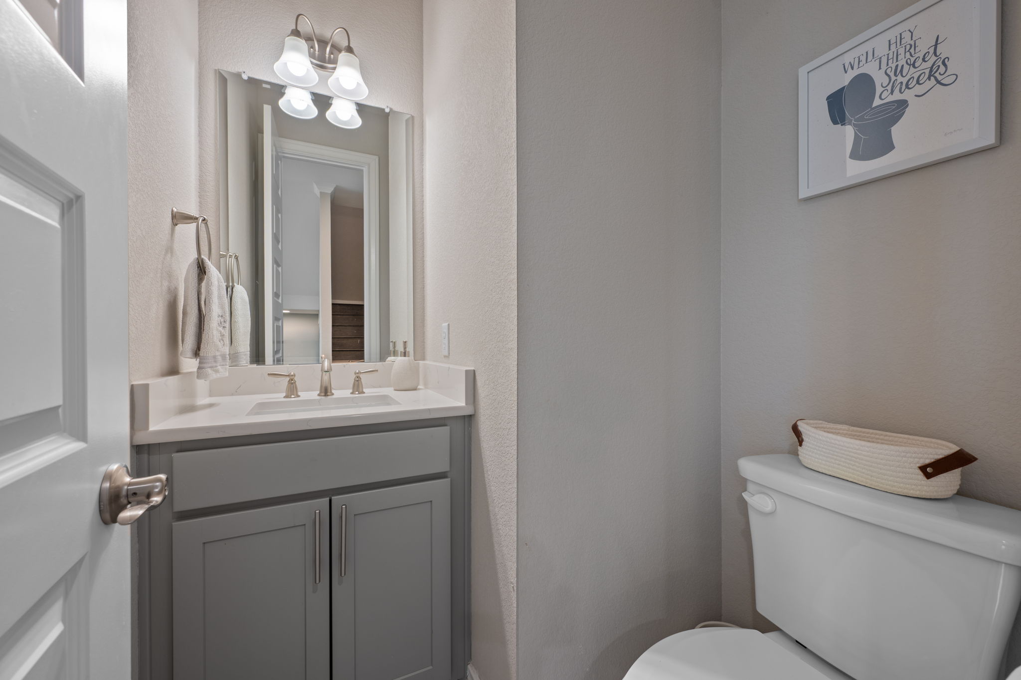 308 Adams Street Georgetown, TX 78628 - Photo 20 of 39 a bathroom with a toilet sink and mirror
