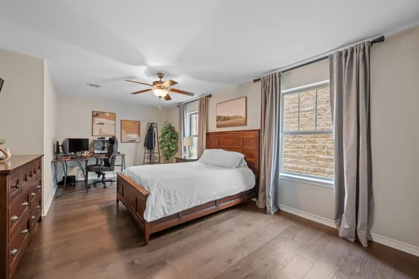a bed room with a bed and a flat screen tv
