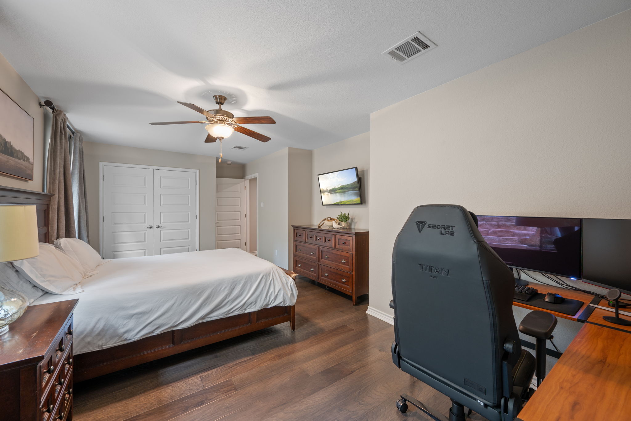 308 Adams Street Georgetown, TX 78628 - Photo 23 of 39 a bedroom with a bed and a chandelier