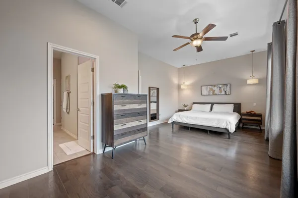 a bedroom with furniture and window