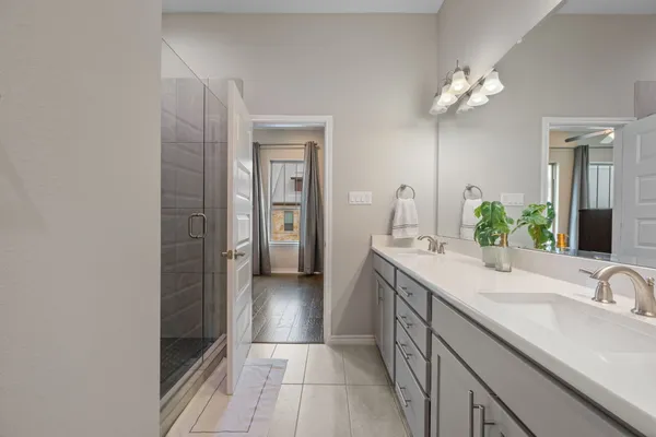 a view of walk in closet with clothes