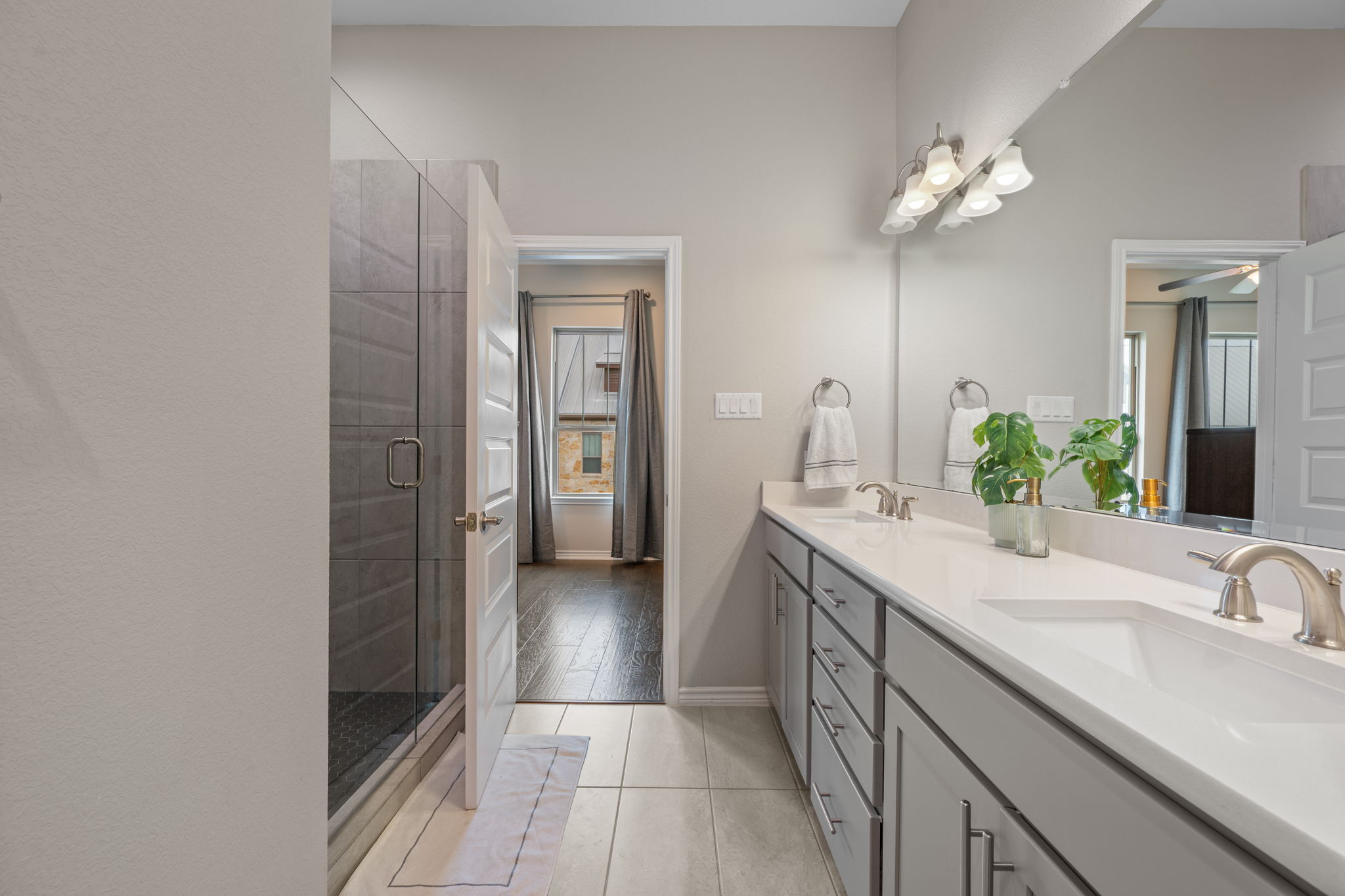 308 Adams Street Georgetown, TX 78628 - Photo 30 of 39 a bathroom with a double vanity sink and a mirror