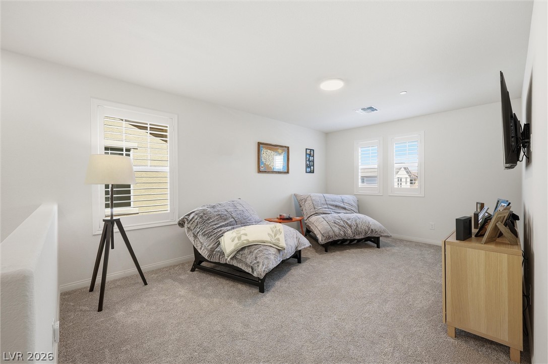 3705 Alla Rocca Avenue Henderson, NV 89044 - Photo 18 of 50 This versatile loft area features light-filled windows, creating an inviting space for relaxation or recreation.