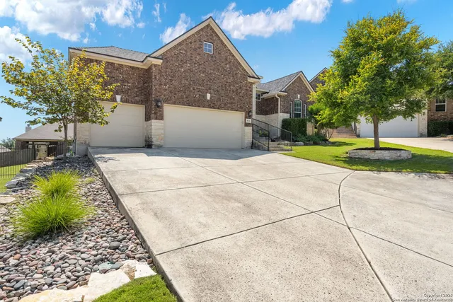 a backyard of a house with plants and trees
