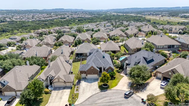 a aerial view of a house with a yard