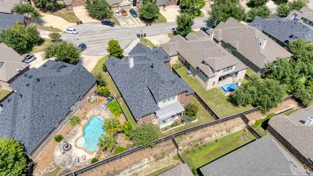 an aerial view of residential houses with outdoor space