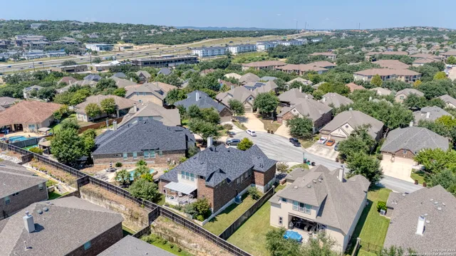 a aerial view of residential houses with outdoor space