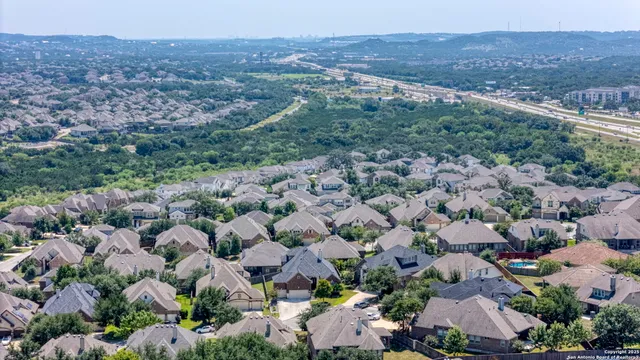 an aerial view of house with yard swimming pool and outdoor seating