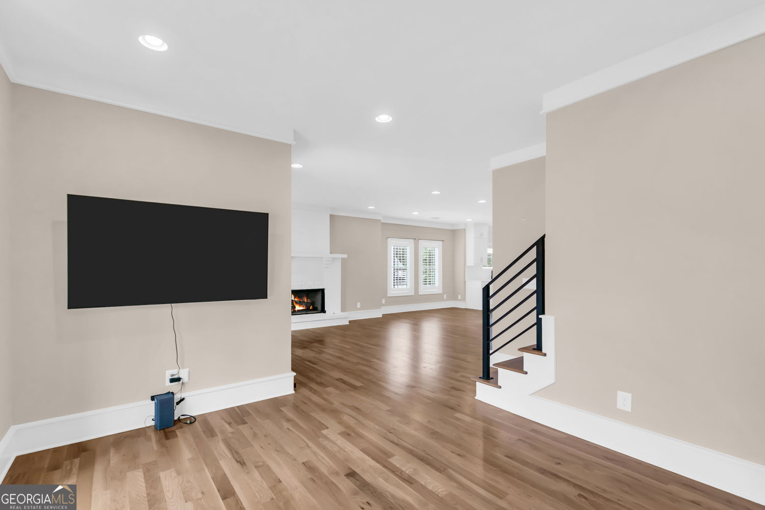 205 Flesner Court Clarkesville, GA 30523 - Photo 13 of 41 a view of a livingroom with wooden floor and a flat screen tv